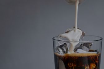 milk pouring in coffee