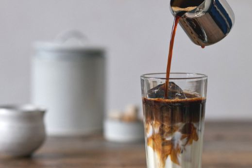 pouring coffee in milk