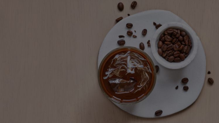 coffee with beans next to it