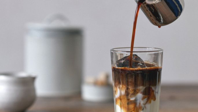 pouring coffee in milk