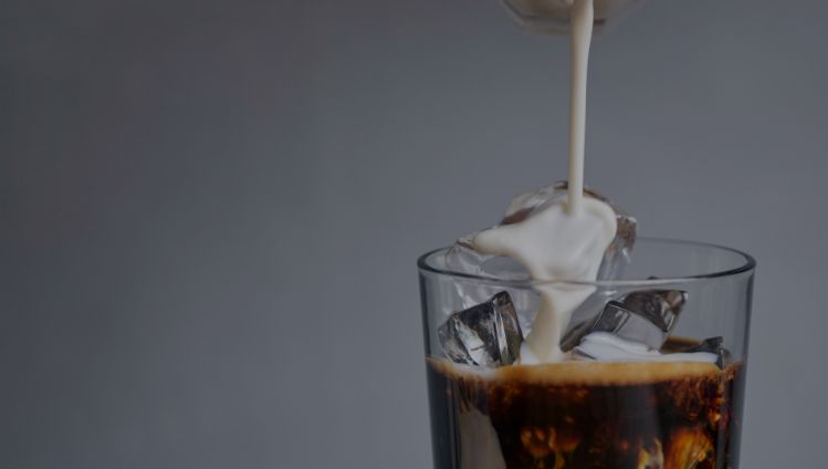 milk pouring in coffee